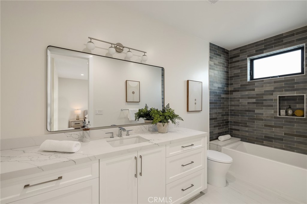 1820 9th Street Manhattan Beach, CA 90266 - Photo 65 of 75 a bathroom with a sink a toilet and shower