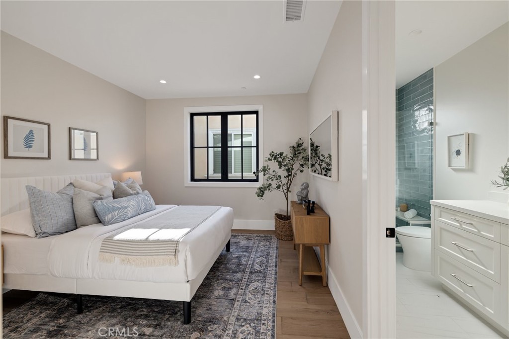 1820 9th Street Manhattan Beach, CA 90266 - Photo 67 of 75 a bedroom with a large bed and a couch