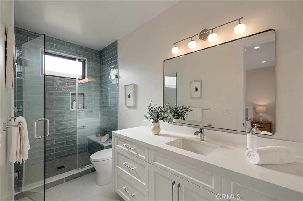 1820 9th Street Manhattan Beach, CA 90266 - Photo 69 of 75 a bathroom with a double vanity sink mirror and shower