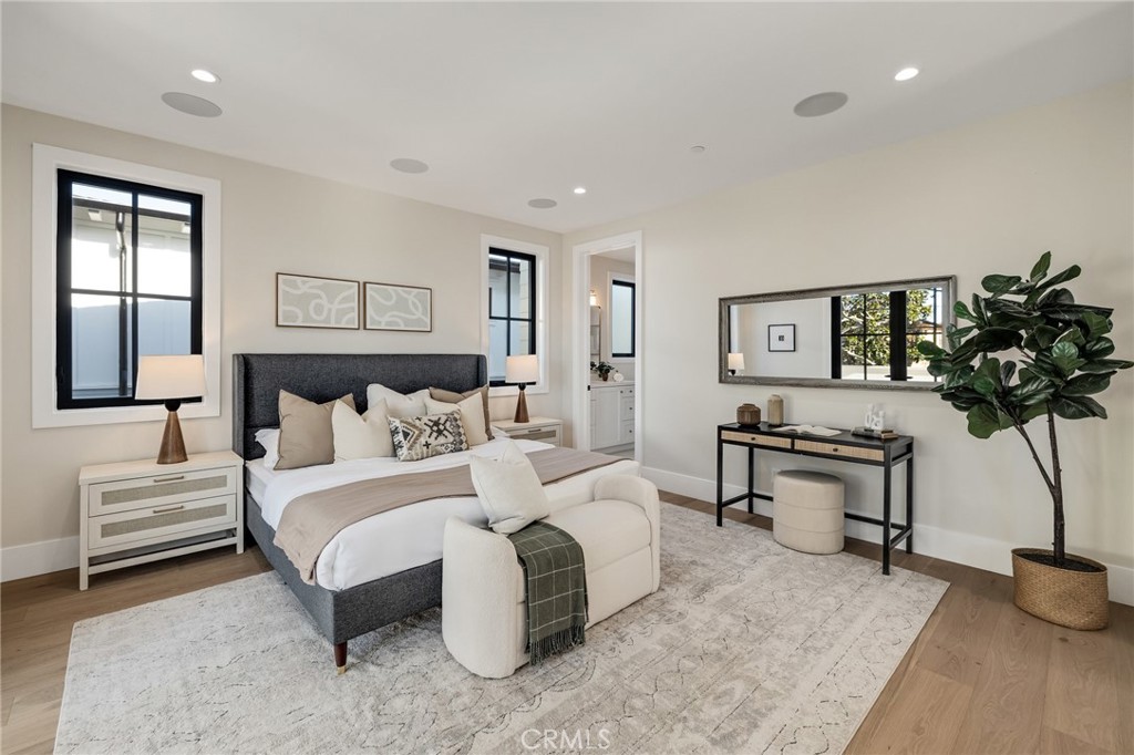1820 9th Street Manhattan Beach, CA 90266 - Photo 74 of 75 a bedroom with a bed a couch and potted plant
