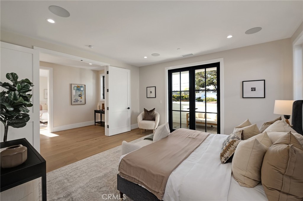 1820 9th Street Manhattan Beach, CA 90266 - Photo 75 of 75 a bedroom with a bed and a potted plant