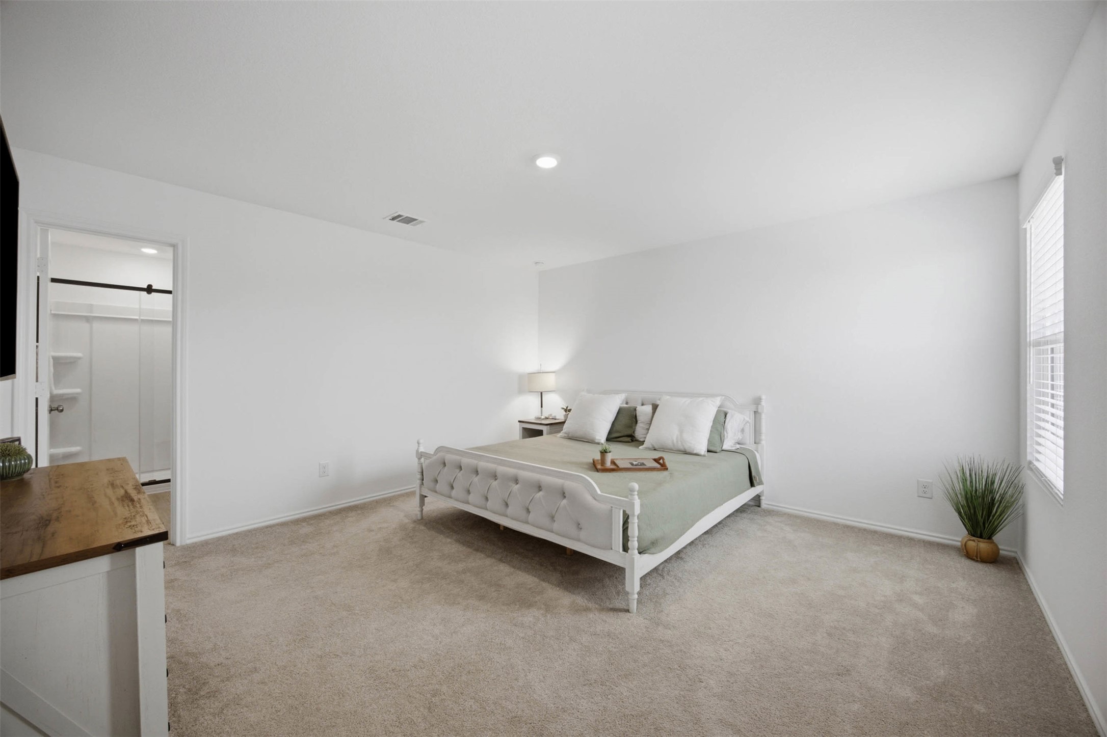 171 Cattle Queen Road Jarrell, TX 76537 - Photo 20 of 38 Recessed lighting and wall-to-wall carpeting define this peaceful private retreat.