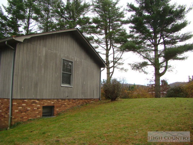 164 New Way Road Boone, NC 28607 - Photo 11 of 17 a backyard of a house with lots of green space