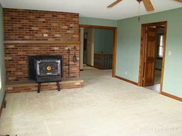 164 New Way Road Boone, NC 28607 - Photo 14 of 17 a living room with furniture and a fireplace