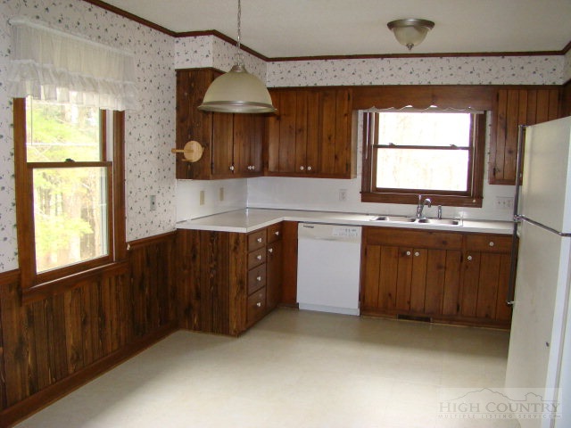 164 New Way Road Boone, NC 28607 - Photo 15 of 17 a kitchen with a sink window and cabinets