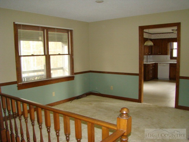 164 New Way Road Boone, NC 28607 - Photo 17 of 17 a bedroom with a bed and a window