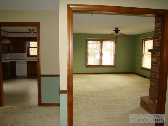 164 New Way Road Boone, NC 28607 - Photo 3 of 17 a view of an empty room with a window and fire place