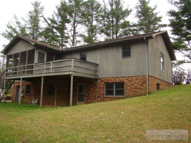 164 New Way Road Boone, NC 28607 - Photo 10 of 17 a house with trees in the background