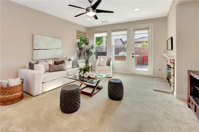 a living room with furniture and a fireplace