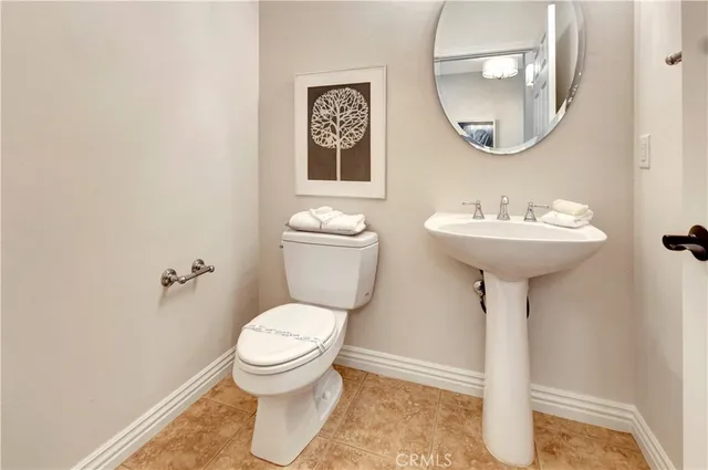 a vase of flowers sitting on a floor