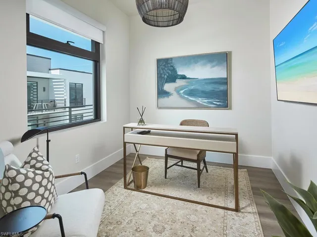 a view of a workspace with furniture