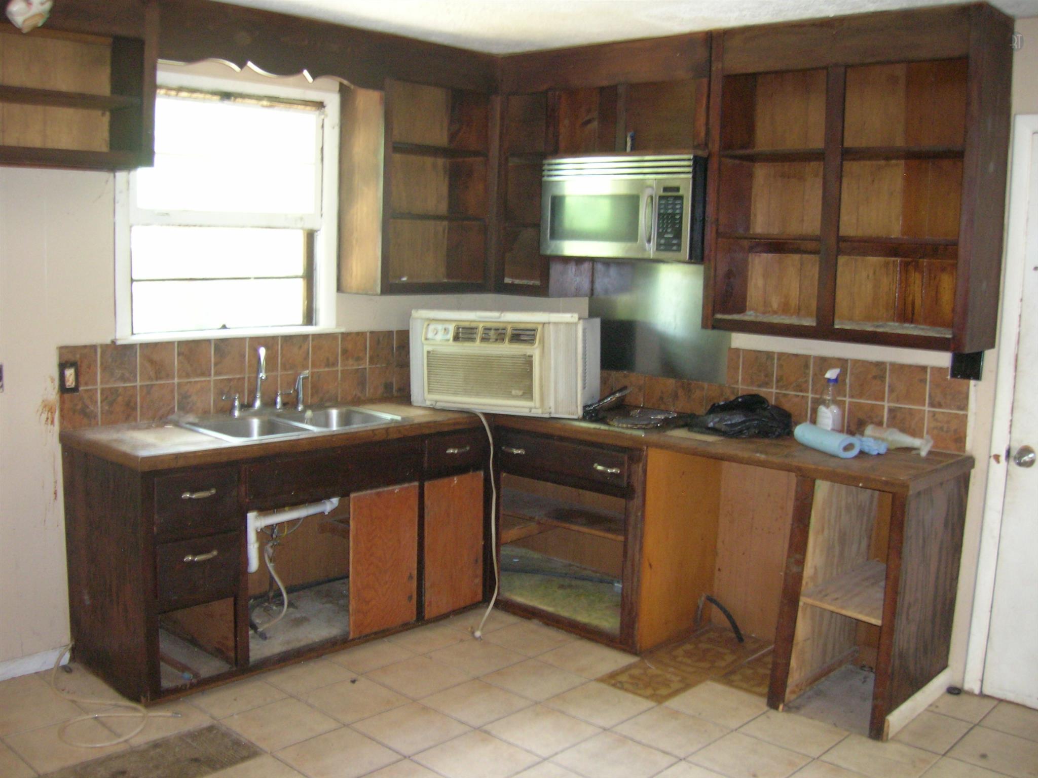 818 Richards Road Antioch, TN 37013 - Photo 10 of 14 Kitchen needs cabinets and appliances. Tile floor needs minor replacements