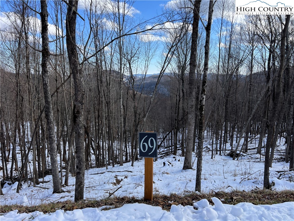 69 Poplar Forest Drive Boone, NC 28607 - Photo 10 of 18 a street sign on a sidewalk next to a road