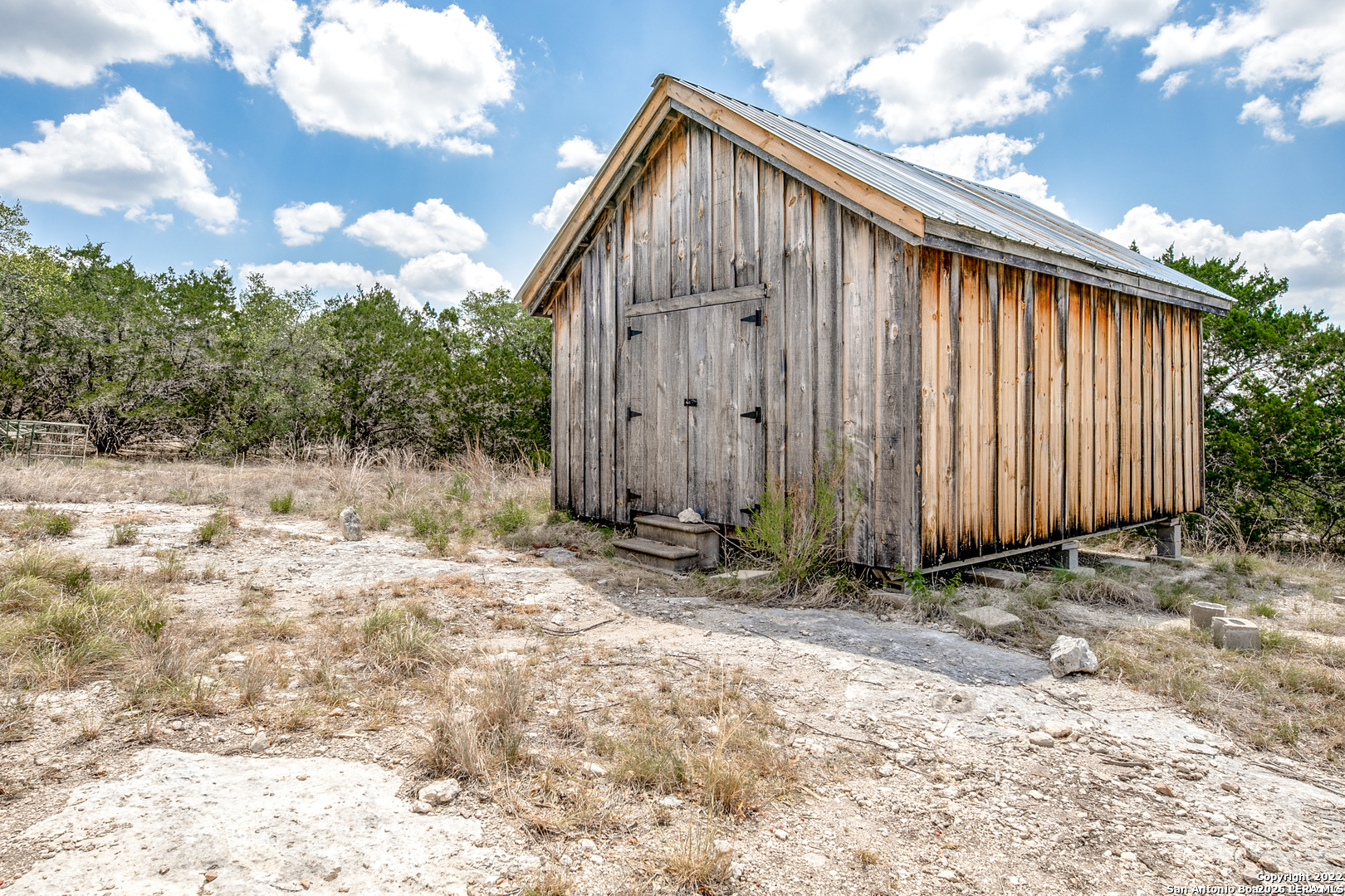 2844 Hidden Valley Road Pipe Creek, TX 78063 - Photo 11 of 30 a backyard of a house
