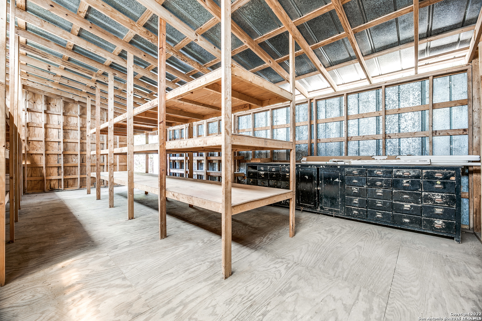 2844 Hidden Valley Road Pipe Creek, TX 78063 - Photo 23 of 30 a view of an empty room with wooden floor