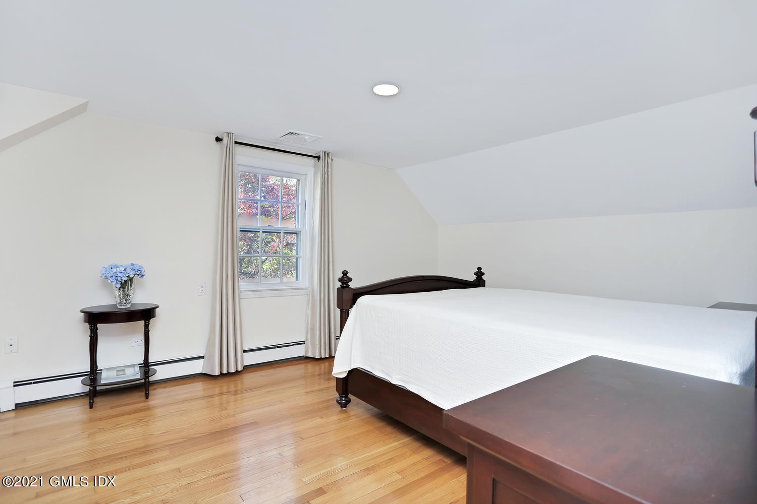 44 Hendrie Avenue Riverside, CT 06878 - Photo 11 of 21 a bedroom with a bed and a table