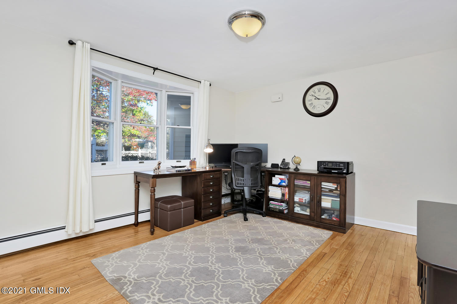 44 Hendrie Avenue Riverside, CT 06878 - Photo 13 of 21 a view of a workspace with furniture and a window