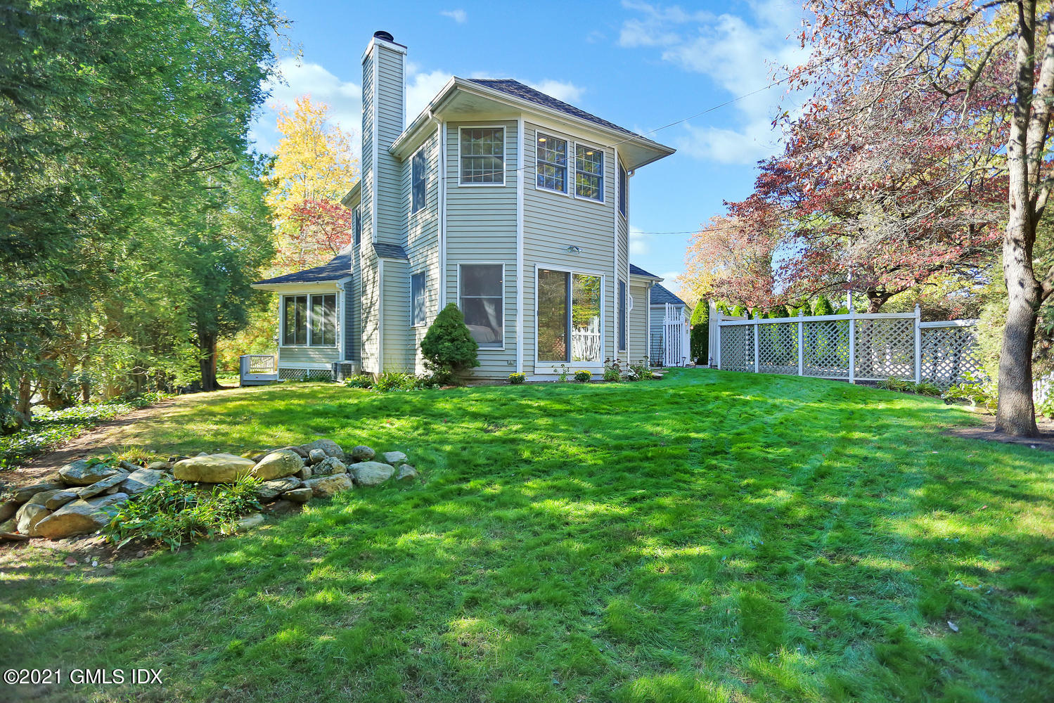44 Hendrie Avenue Riverside, CT 06878 - Photo 20 of 21 a front view of a house with a yard