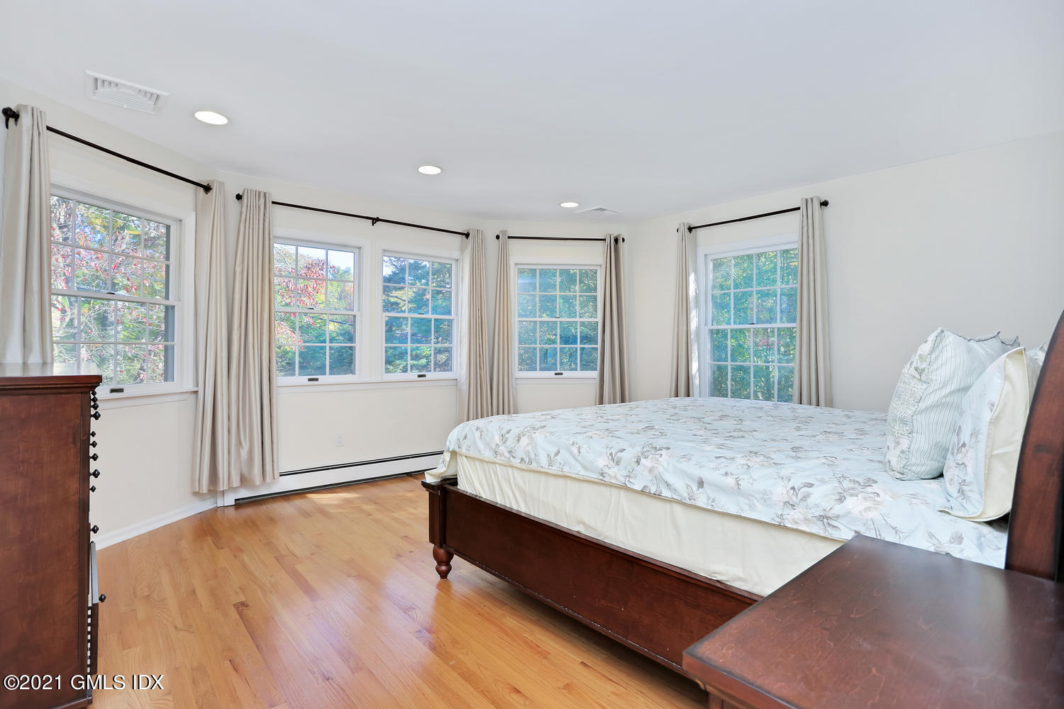 44 Hendrie Avenue Riverside, CT 06878 - Photo 9 of 21 a bed sitting in a spacious bedroom next to a window