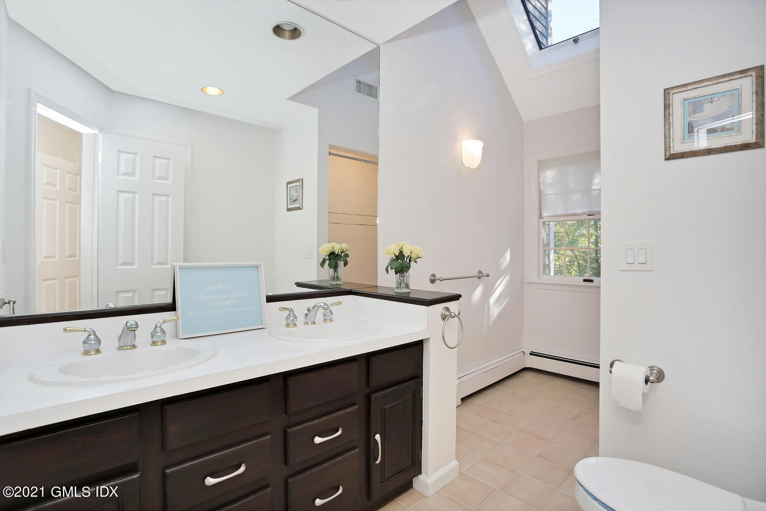 44 Hendrie Avenue Riverside, CT 06878 - Photo 10 of 21 a bathroom with a sink vanity granite and toilet
