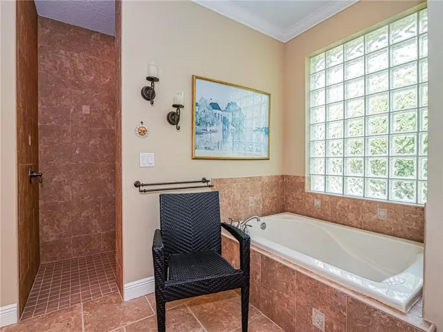 a bathroom with a bathtub and a window
