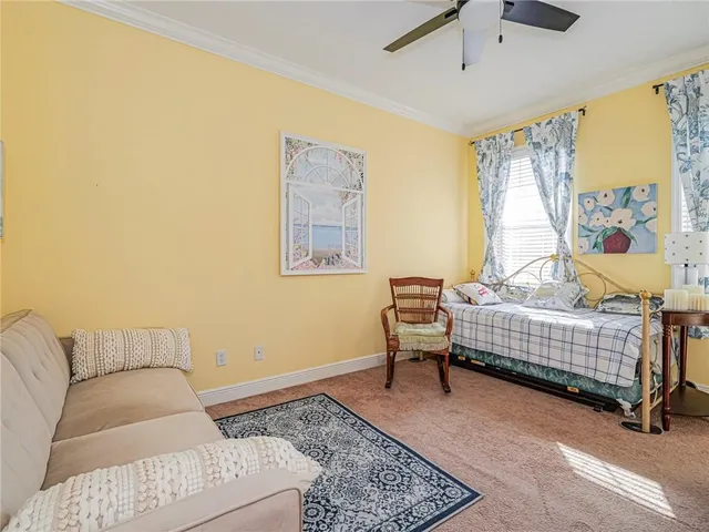 a bedroom with a bed and a couch