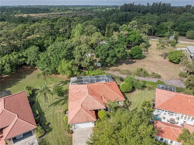 an aerial view of a house with a garden