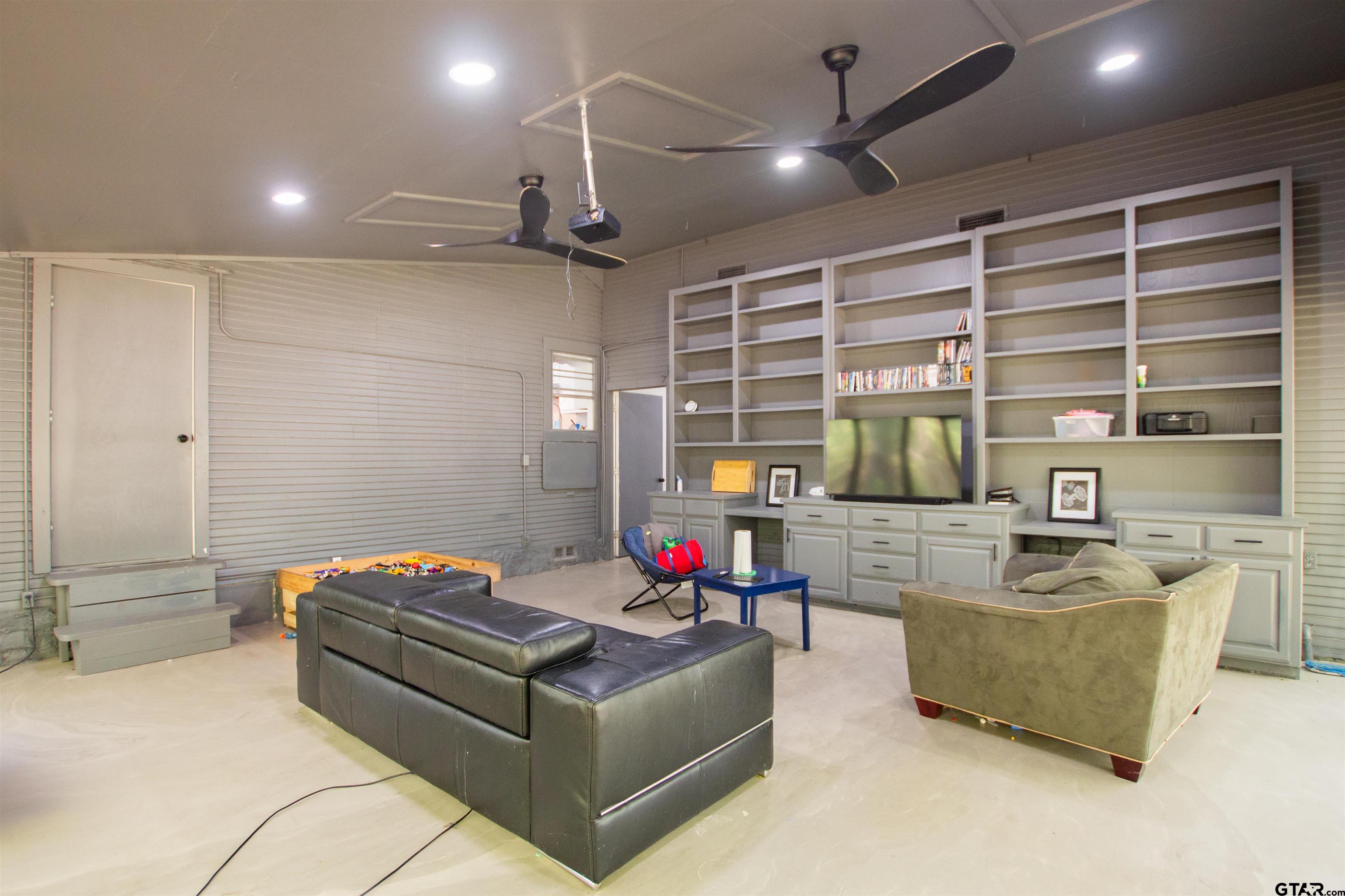2942 Medlin Road Gilmer, TX 75645 - Photo 12 of 30 a living room with furniture and a flat screen tv