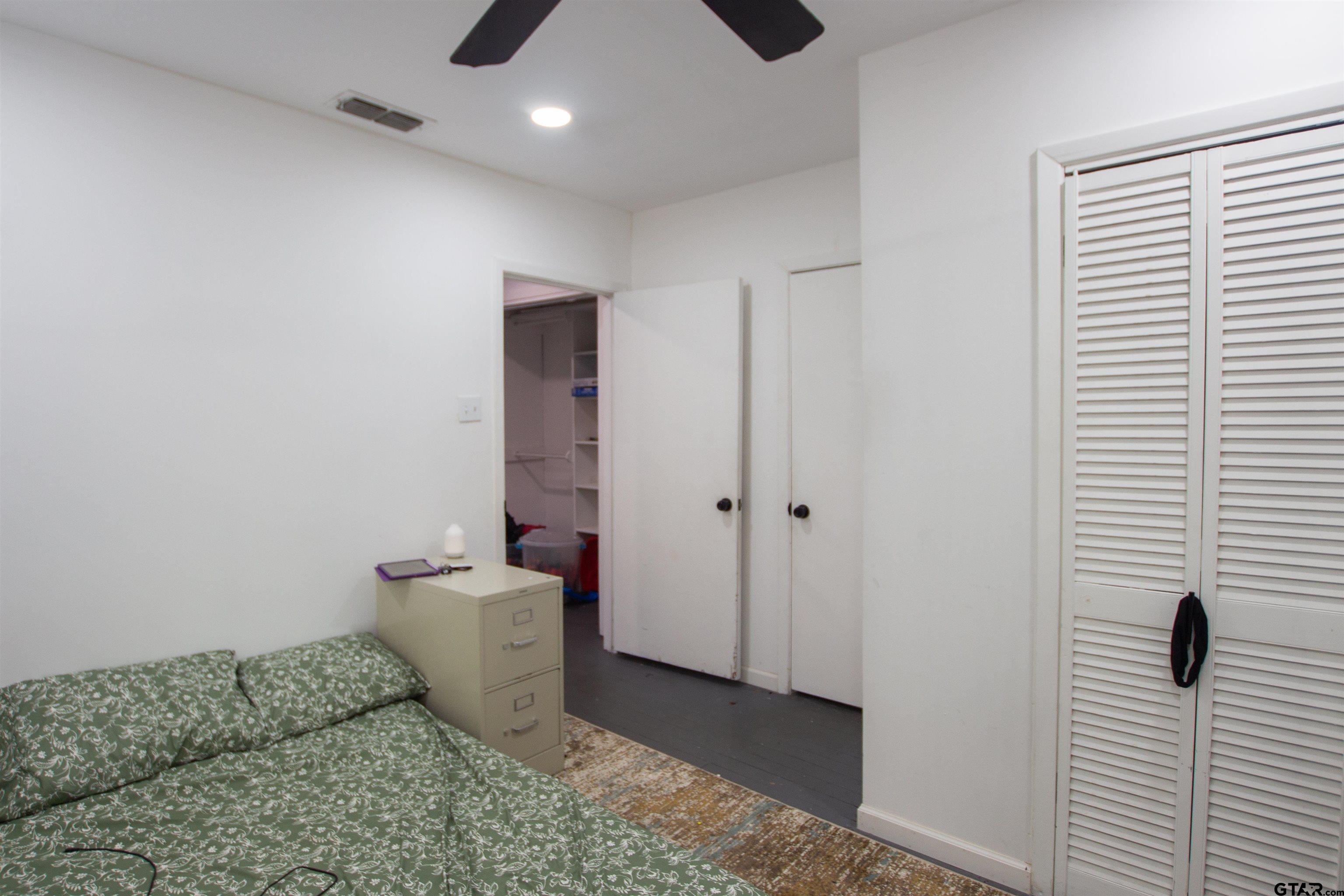 2942 Medlin Road Gilmer, TX 75645 - Photo 22 of 30 a bathroom with a sink and a shower