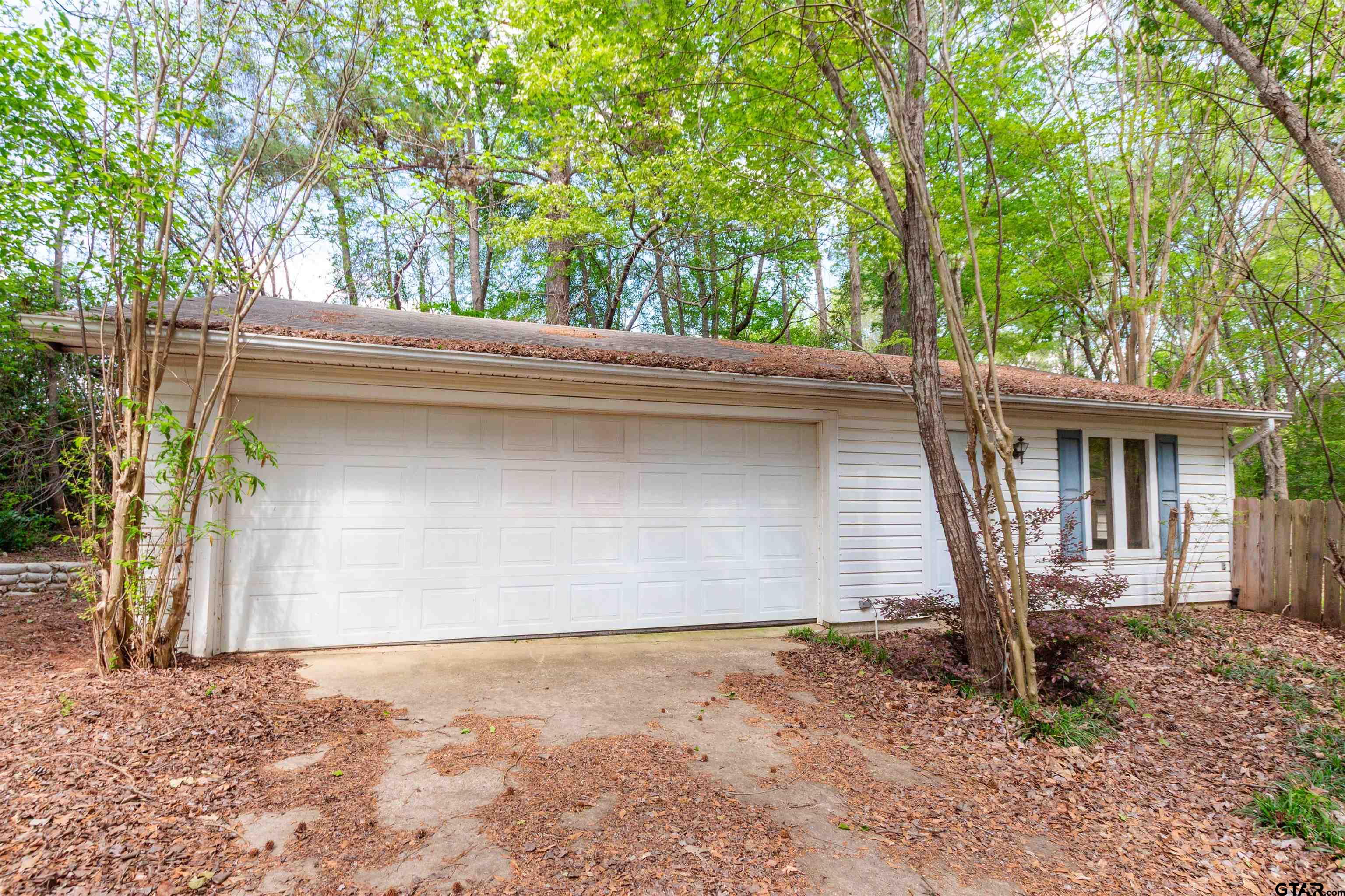 2942 Medlin Road Gilmer, TX 75645 - Photo 27 of 30 a front view of a house with garden