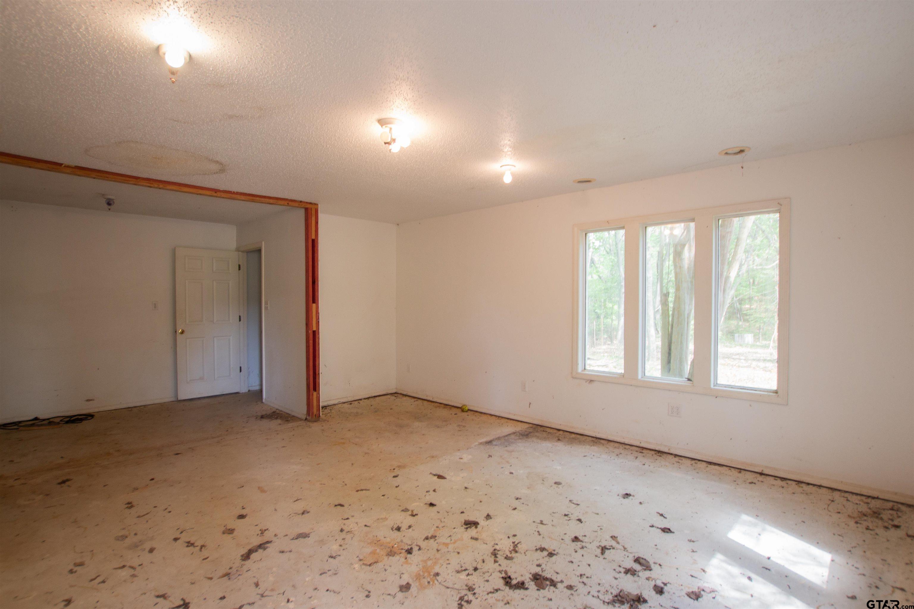 2942 Medlin Road Gilmer, TX 75645 - Photo 28 of 30 a view of an empty room with a window
