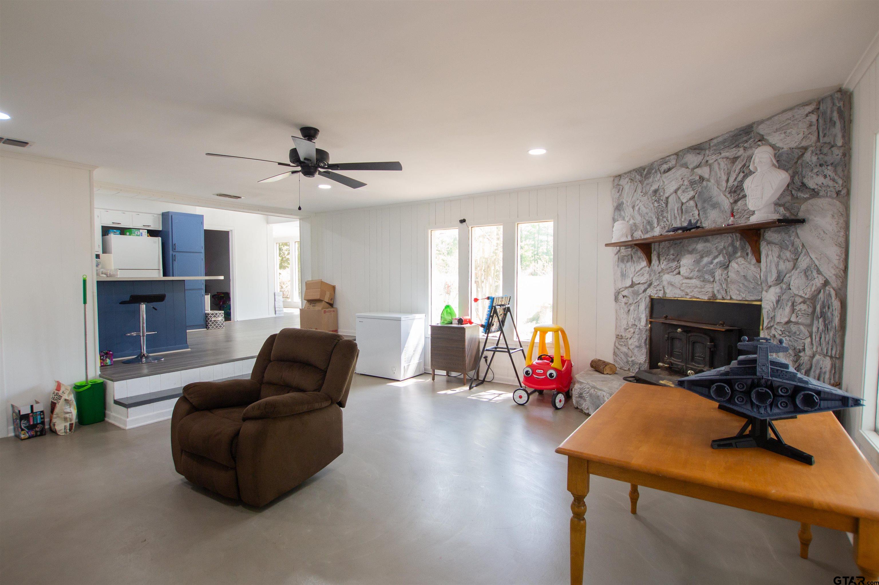 2942 Medlin Road Gilmer, TX 75645 - Photo 4 of 30 a living room with furniture and a fireplace