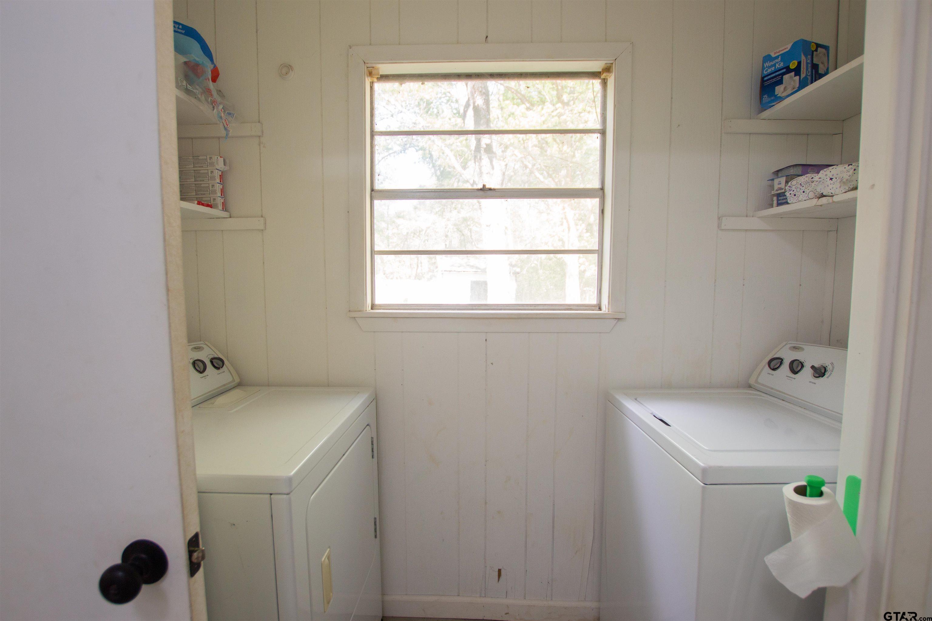 2942 Medlin Road Gilmer, TX 75645 - Photo 7 of 30 a bathroom with a sink and a window