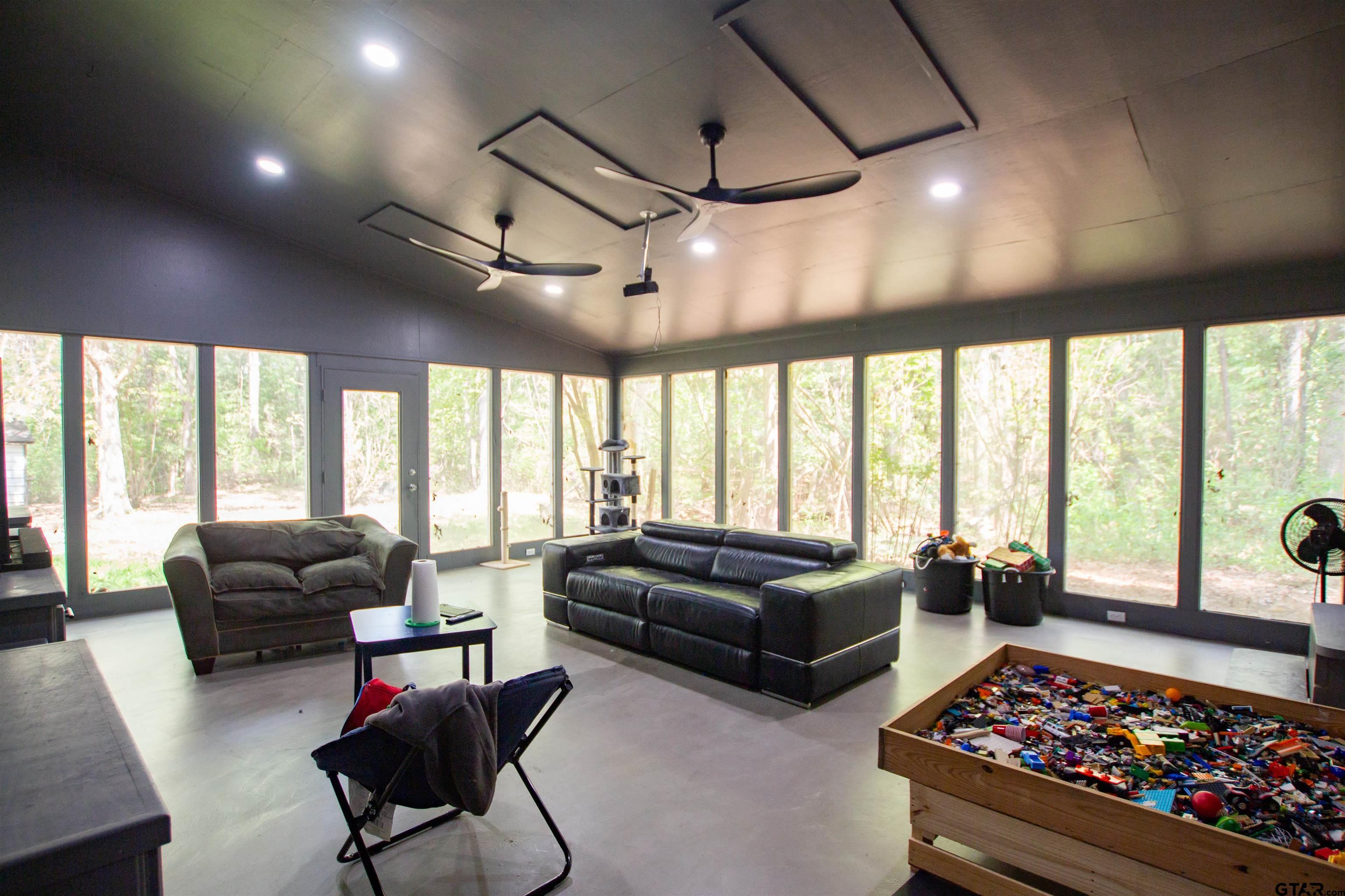 2942 Medlin Road Gilmer, TX 75645 - Photo 10 of 30 a living room with furniture and a large window