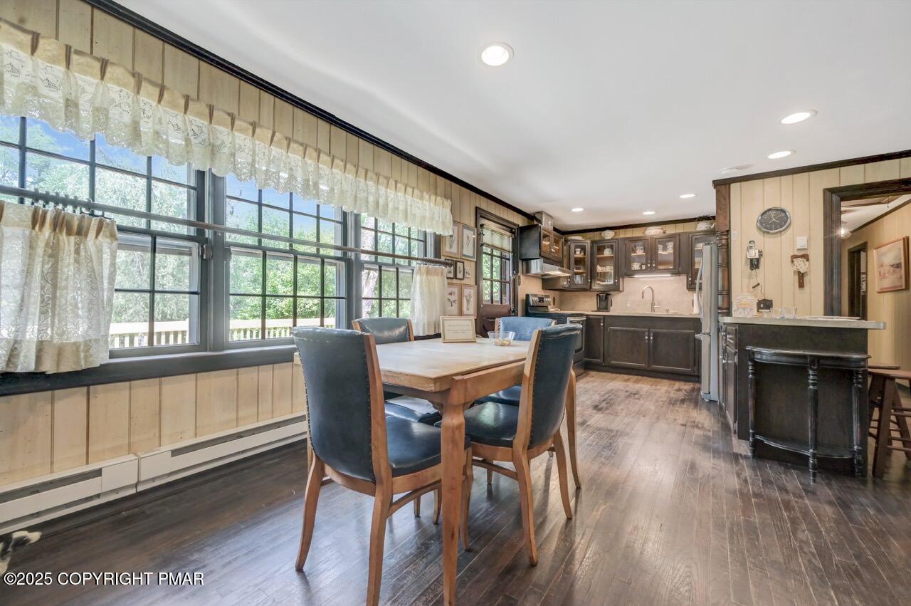 5142 Pine Tree Road Pocono Summit, PA 18346 - Photo 15 of 57 a dining room with furniture window wooden floor
