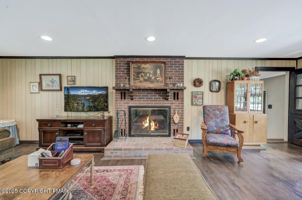 5142 Pine Tree Road Pocono Summit, PA 18346 - Photo 18 of 57 a living room with furniture a flat screen tv and a fireplace