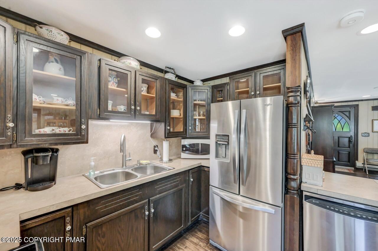 5142 Pine Tree Road Pocono Summit, PA 18346 - Photo 24 of 57 a kitchen with stainless steel appliances granite countertop a refrigerator and a sink