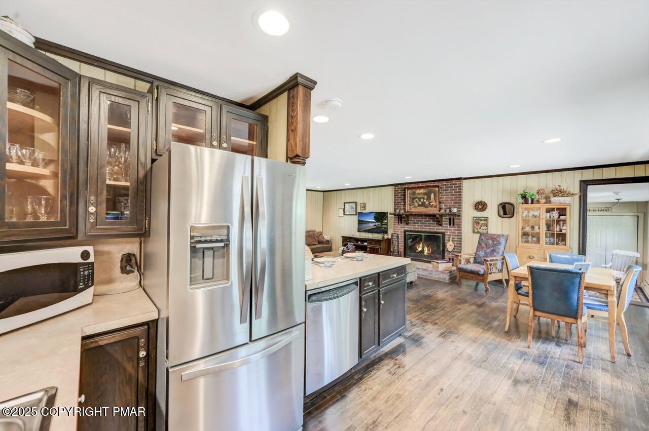 5142 Pine Tree Road Pocono Summit, PA 18346 - Photo 25 of 57 a kitchen with stainless steel appliances a refrigerator and a stove top oven