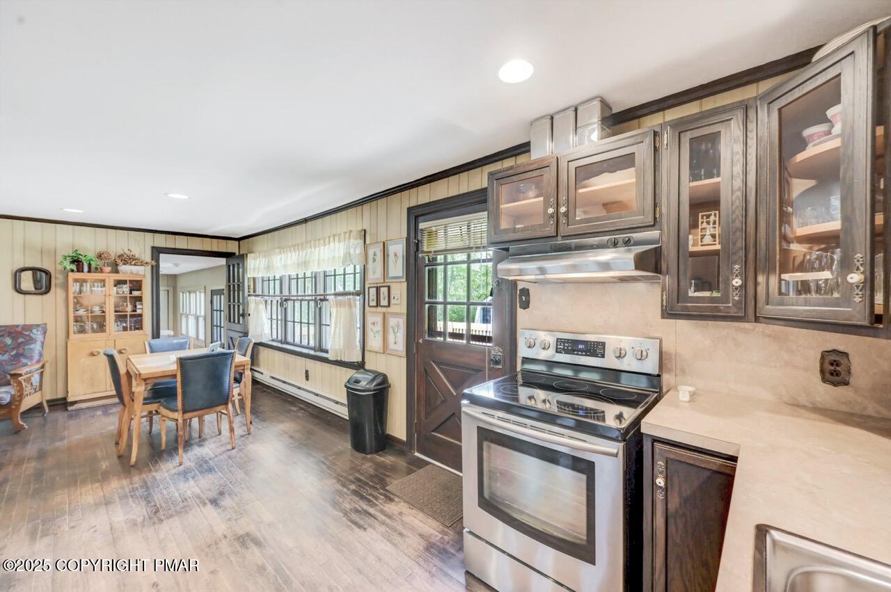 5142 Pine Tree Road Pocono Summit, PA 18346 - Photo 27 of 57 a kitchen with stove and cabinets