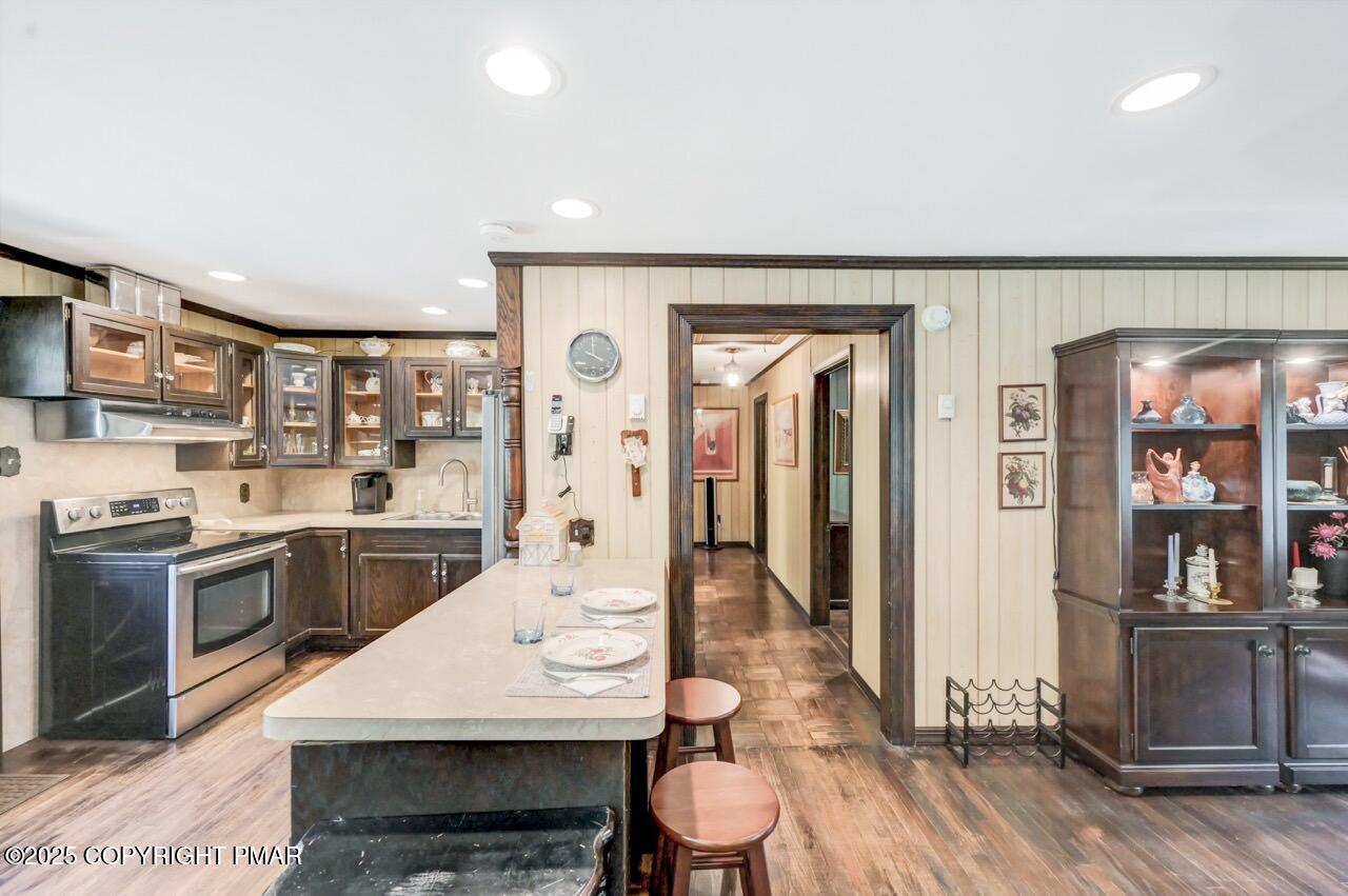 5142 Pine Tree Road Pocono Summit, PA 18346 - Photo 29 of 57 a large kitchen with a table and chairs