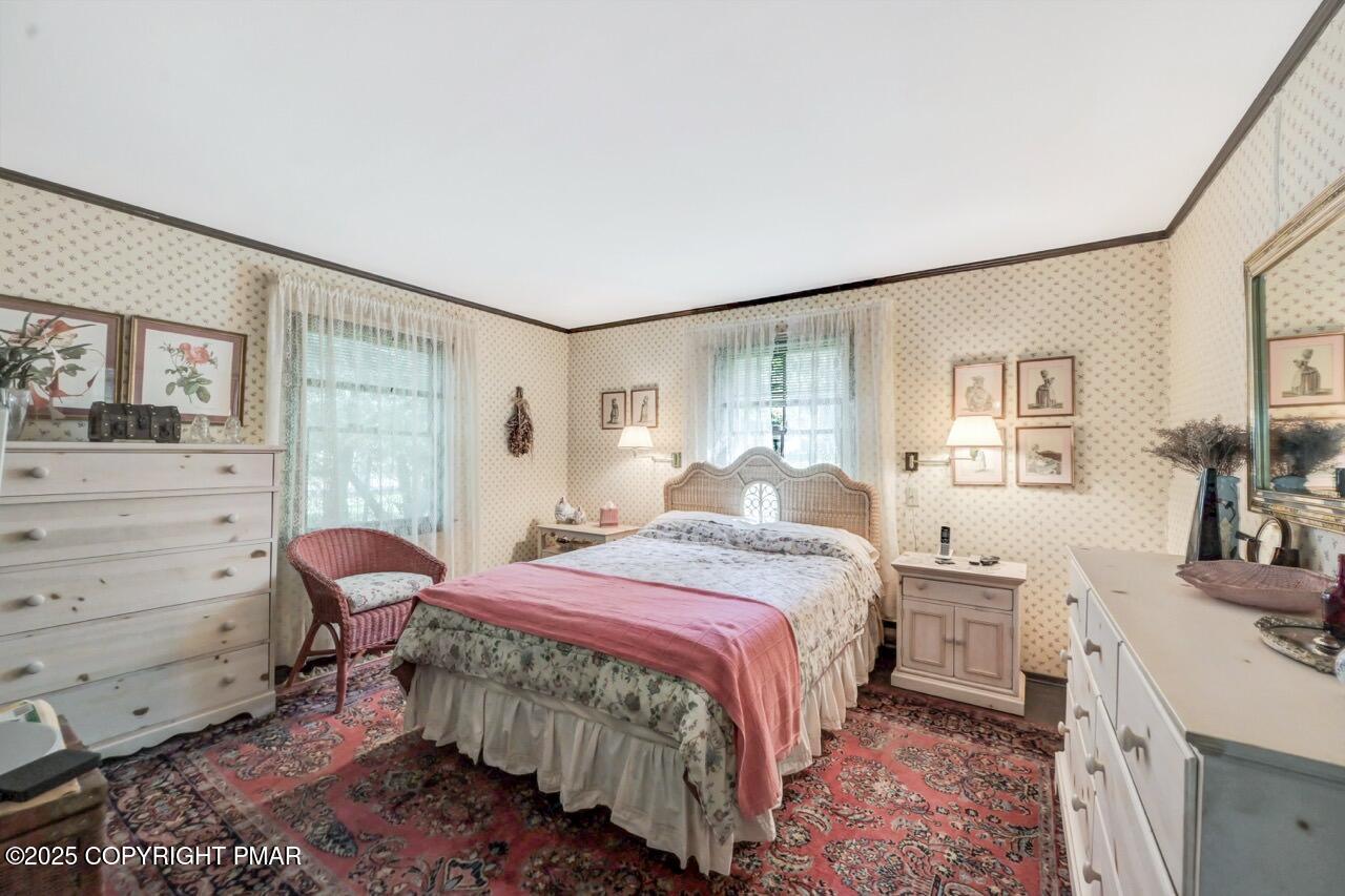 5142 Pine Tree Road Pocono Summit, PA 18346 - Photo 30 of 57 a bedroom with a bed and wooden floor