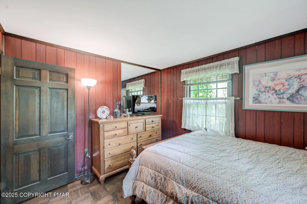 5142 Pine Tree Road Pocono Summit, PA 18346 - Photo 37 of 57 a bedroom with a bed and a dresser