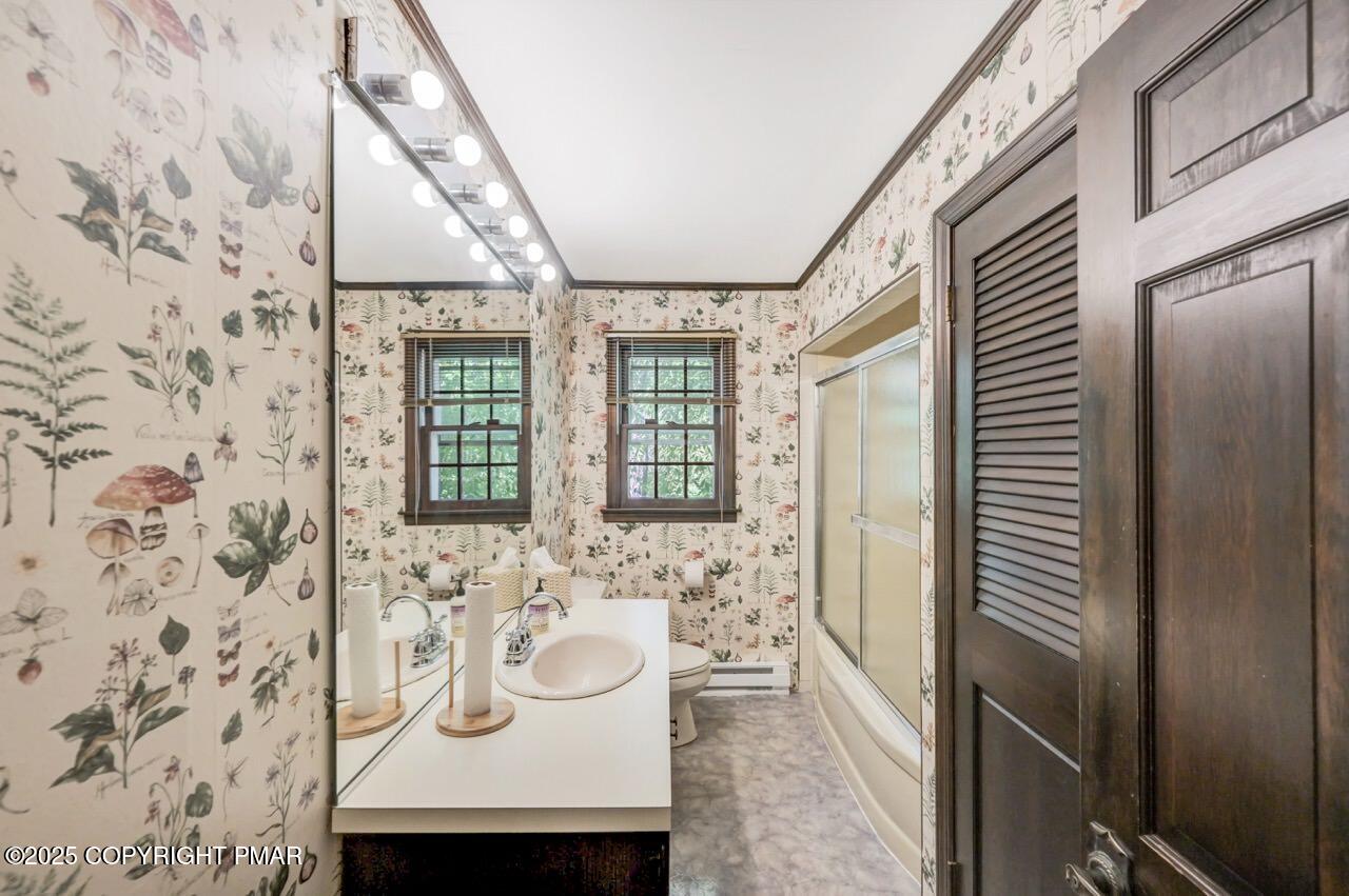 5142 Pine Tree Road Pocono Summit, PA 18346 - Photo 40 of 57 a bathroom with a sink and a mirror