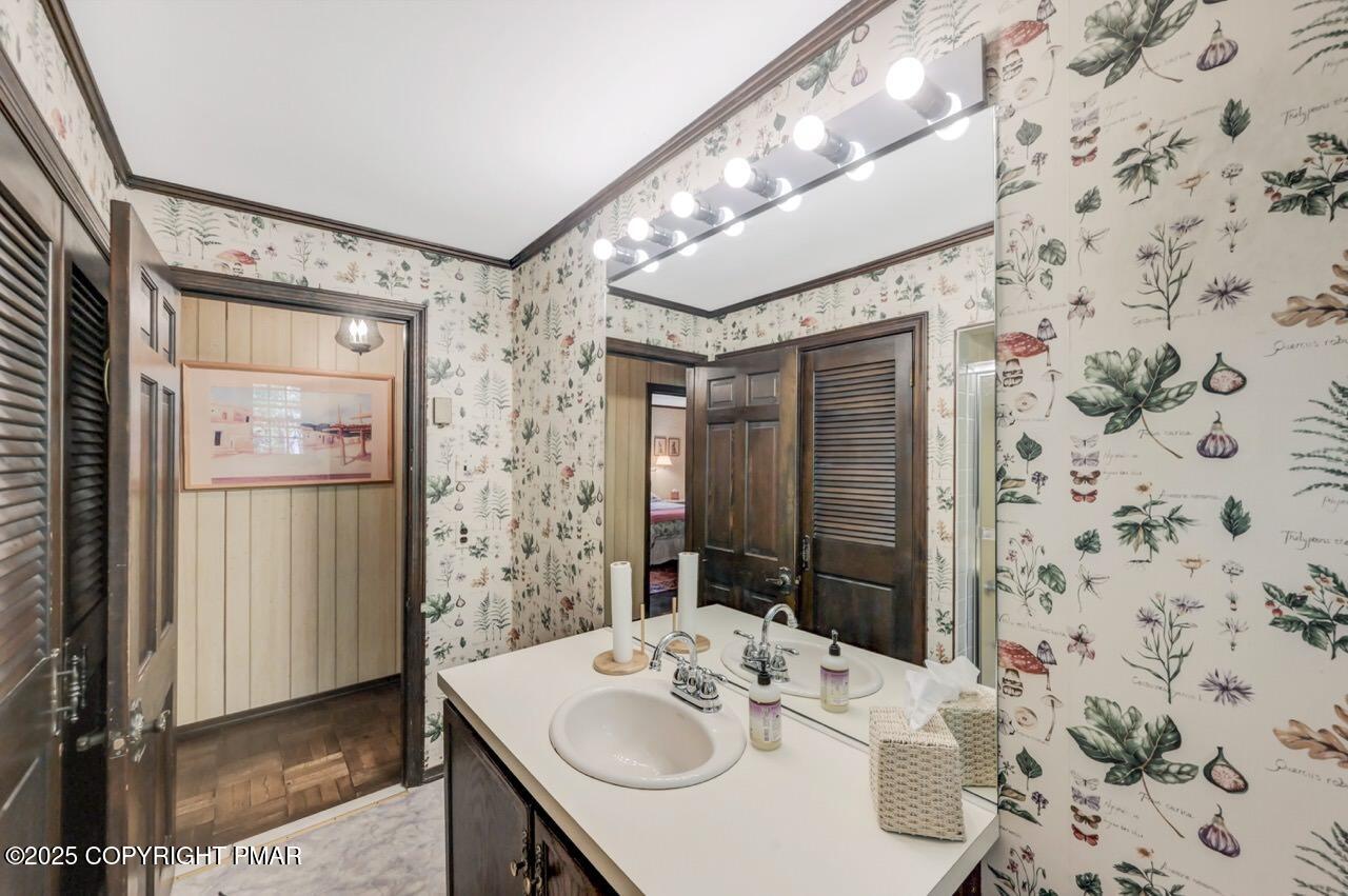 5142 Pine Tree Road Pocono Summit, PA 18346 - Photo 41 of 57 a bathroom with a sink and a mirror