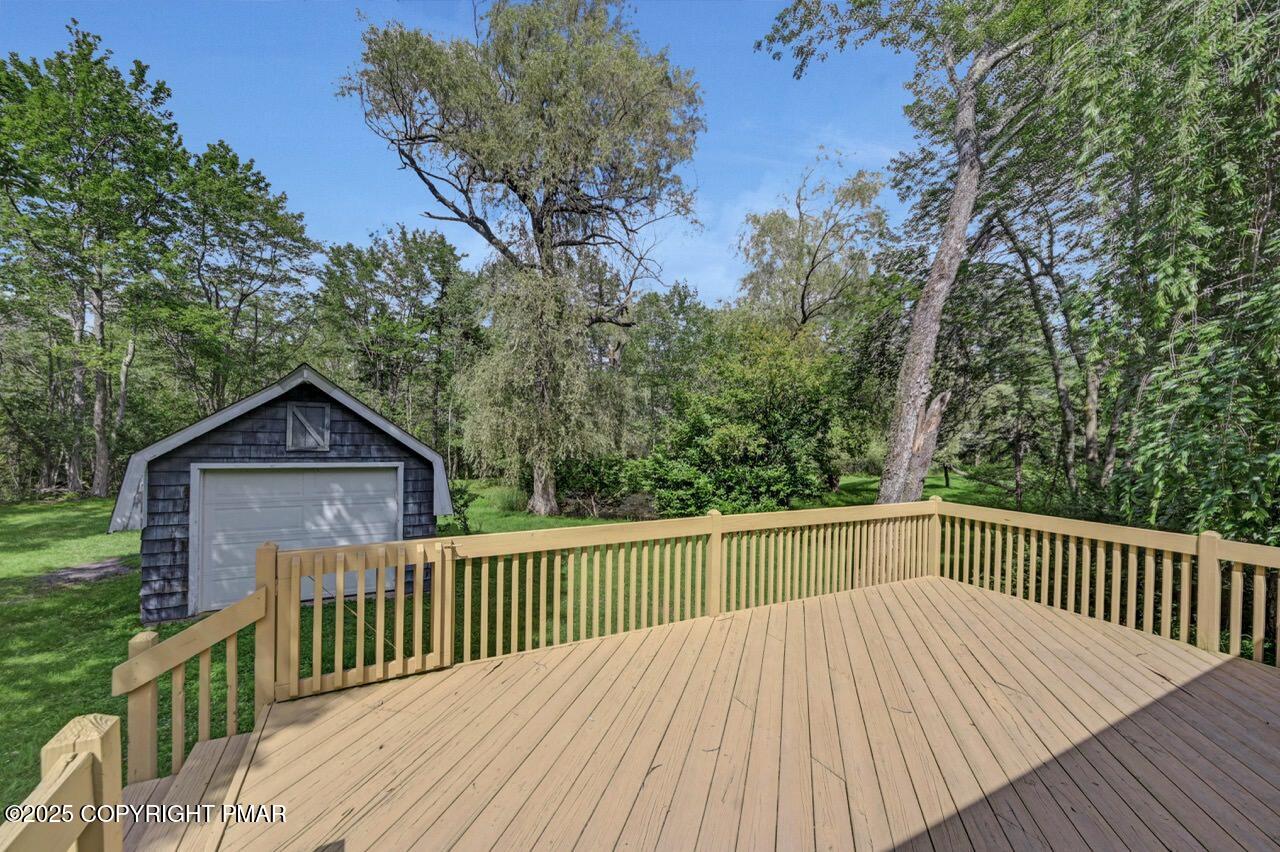 5142 Pine Tree Road Pocono Summit, PA 18346 - Photo 51 of 57 a view of a wooden chairs on a deck