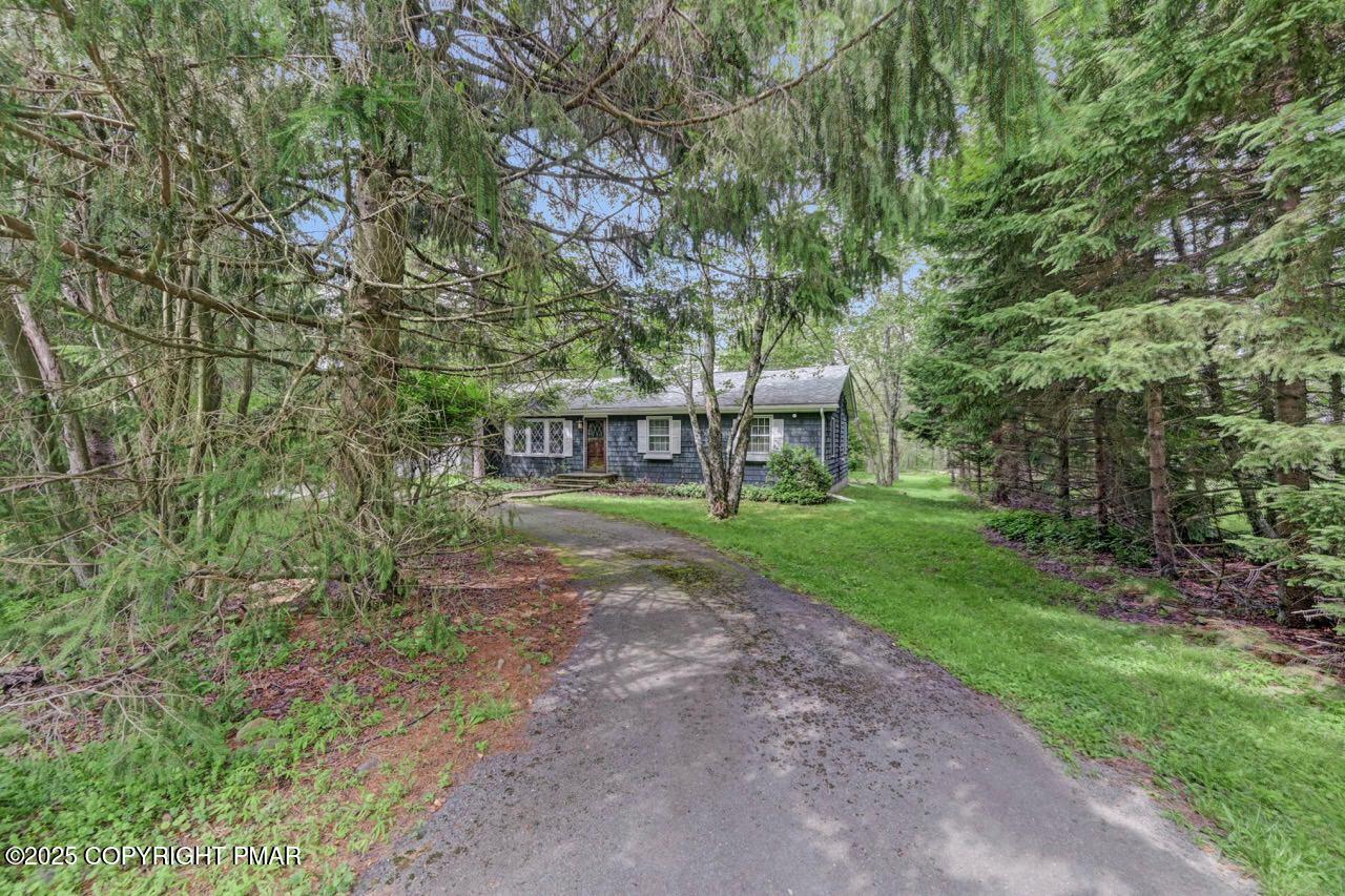 5142 Pine Tree Road Pocono Summit, PA 18346 - Photo 57 of 57 a view of a house with a yard