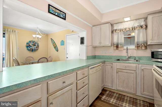 a kitchen with sink cabinets and window
