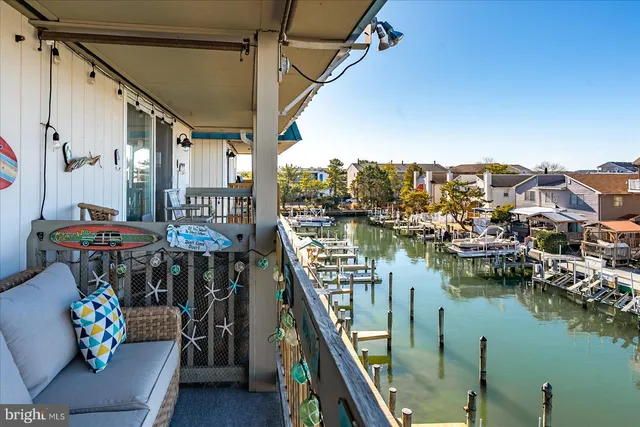 a view of a balcony with furniture