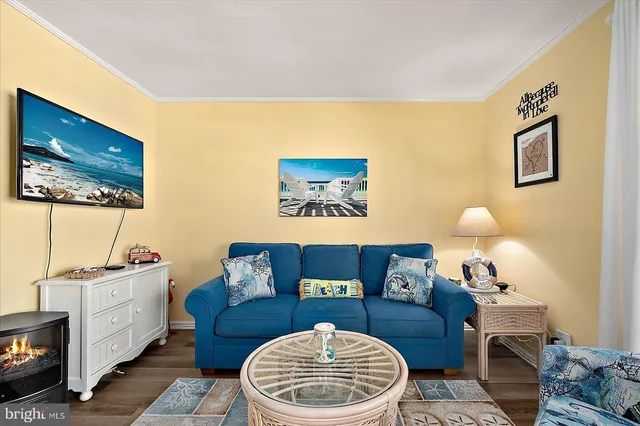 a living room with furniture and a lamp