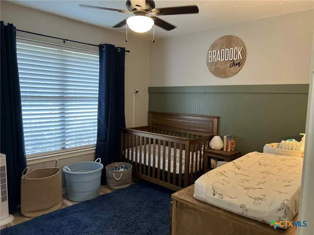 a bedroom with furniture and a window